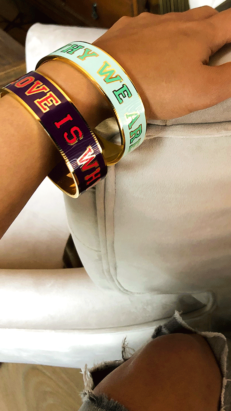 Cuff Bracelets Gold and Purple/Green with text, saying: “Love is why we are here.” By George Gina & Lucy Atelier Astrid & Antoinette 