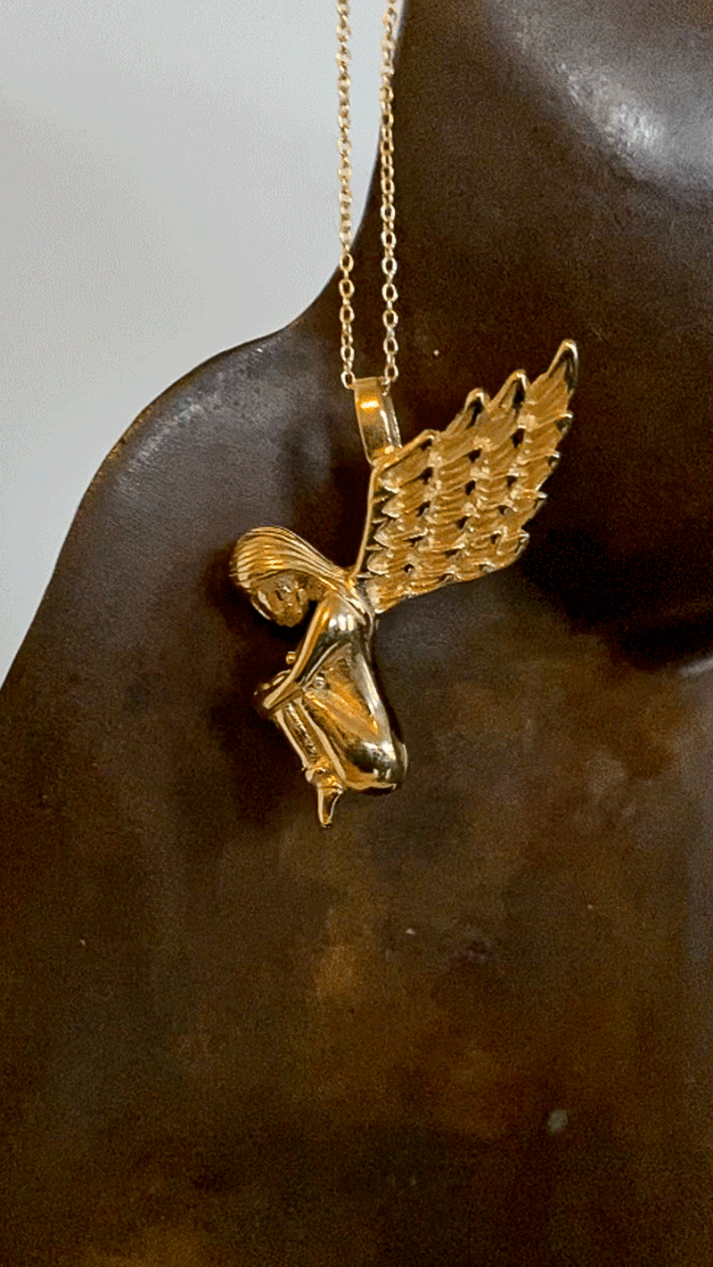 Golden Angel necklace with wings.