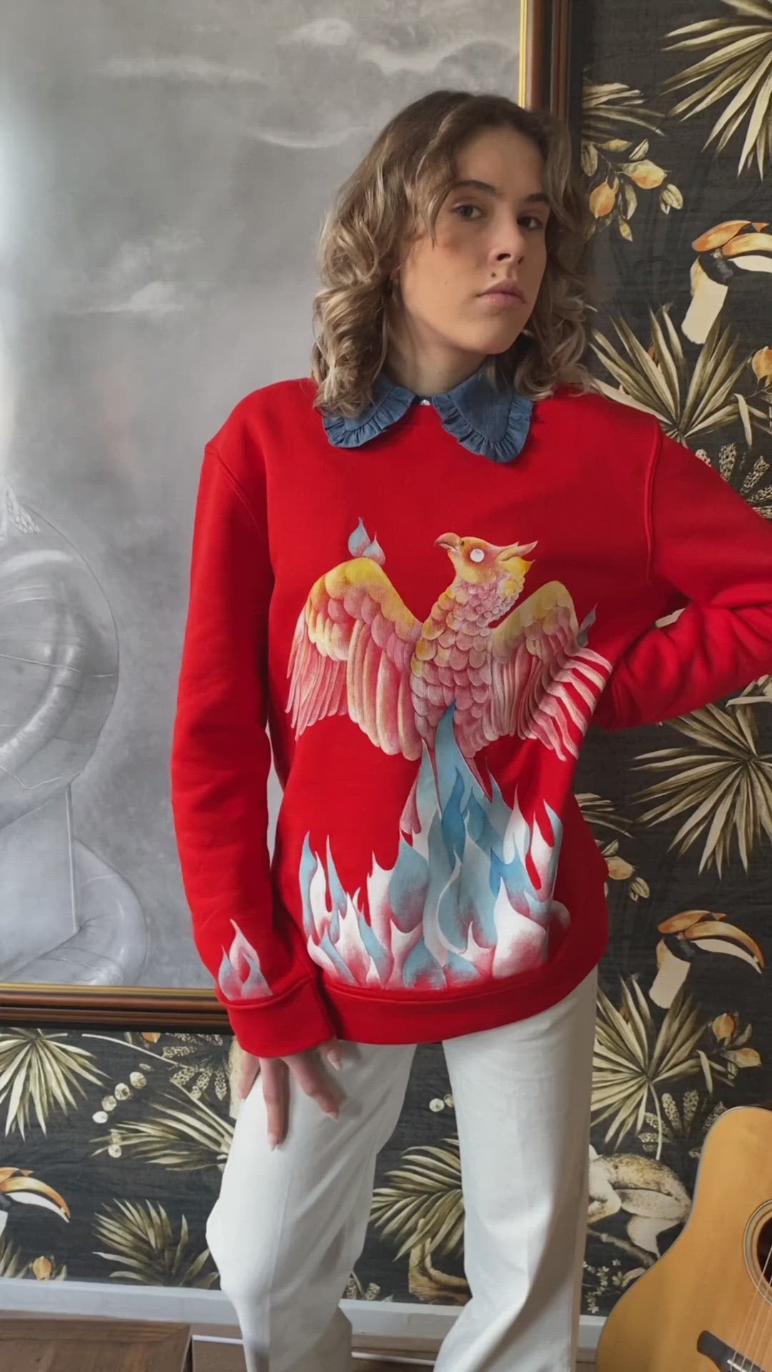 Video of Hand-painted Red Vegan Sweatshirt with an illustration of The Phoenix, painted with non-toxic paints by Atelier Astrid & Antoinette